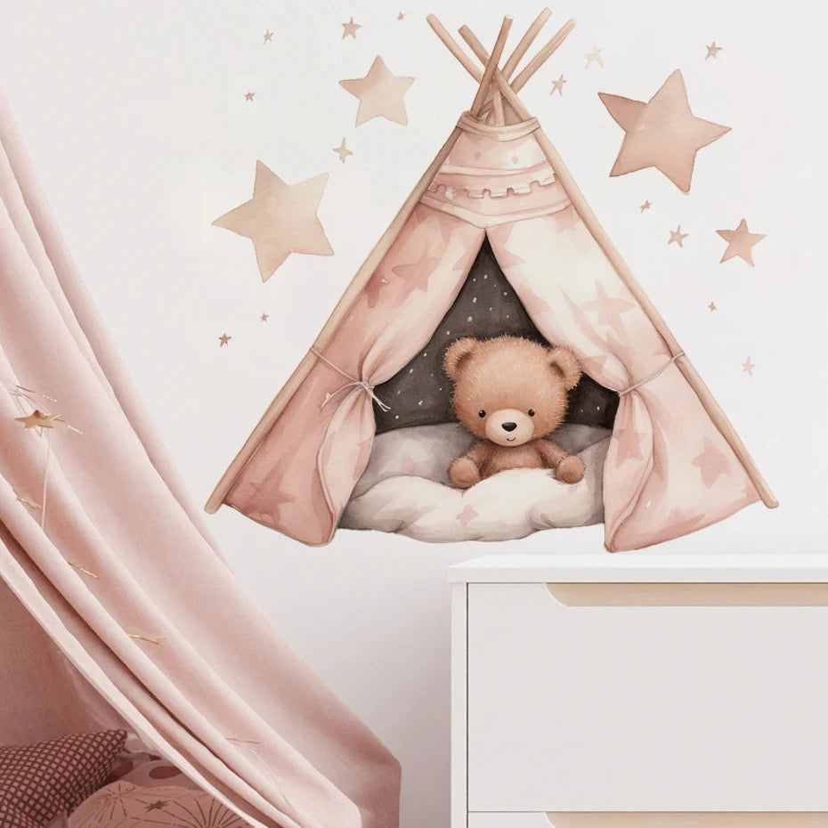 Children's room with a pink teepee, teddy bear, and star decorations on a light pink wall.