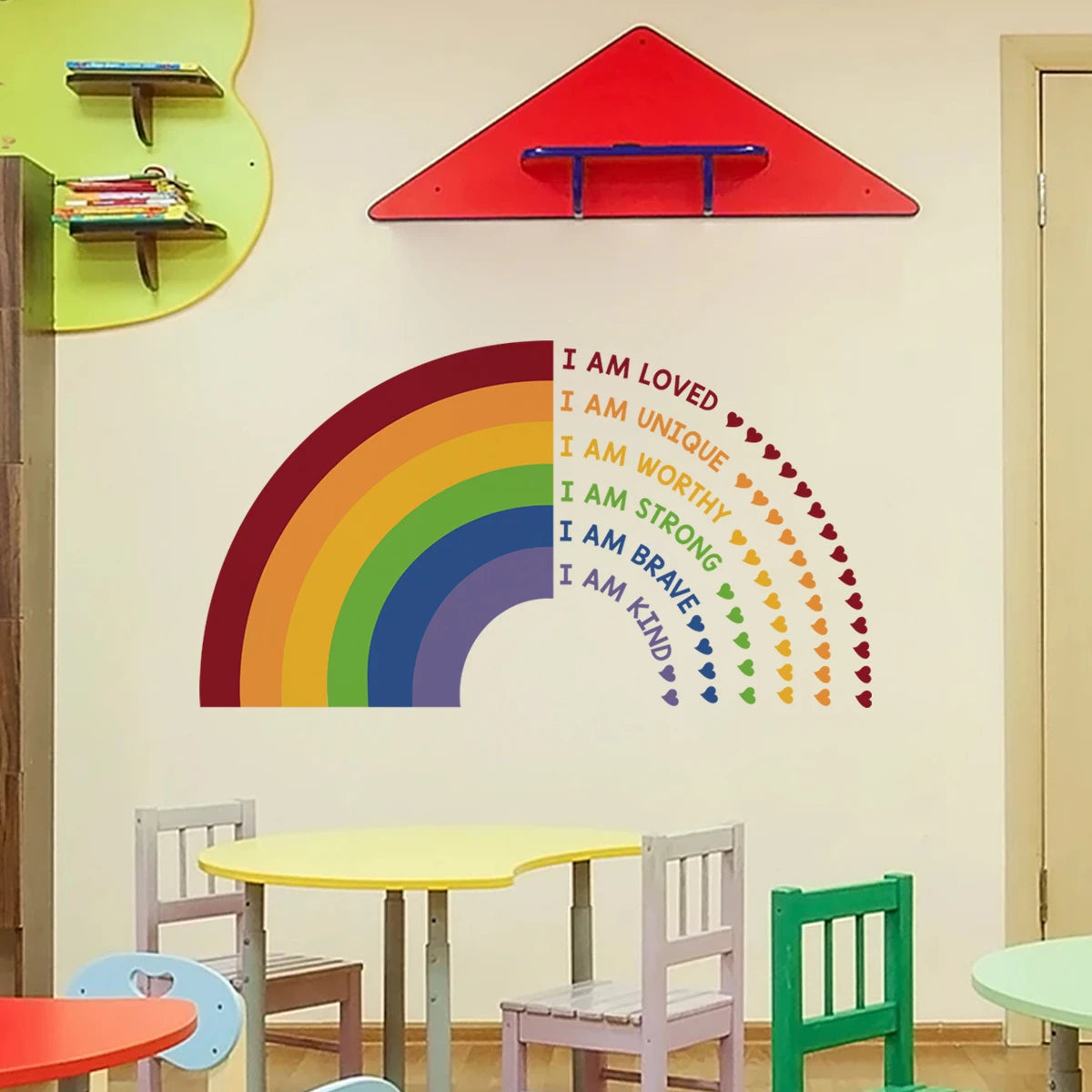 Children's playroom with a rainbow wall decal and motivational phrases.
