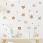 Children's room with animal-themed wall decals and toys on a table.