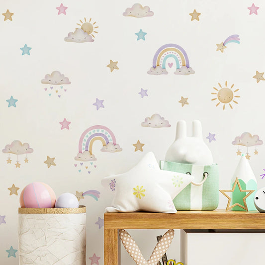 Children's room with decorative wall stickers of rainbows, stars, and clouds on a light background.