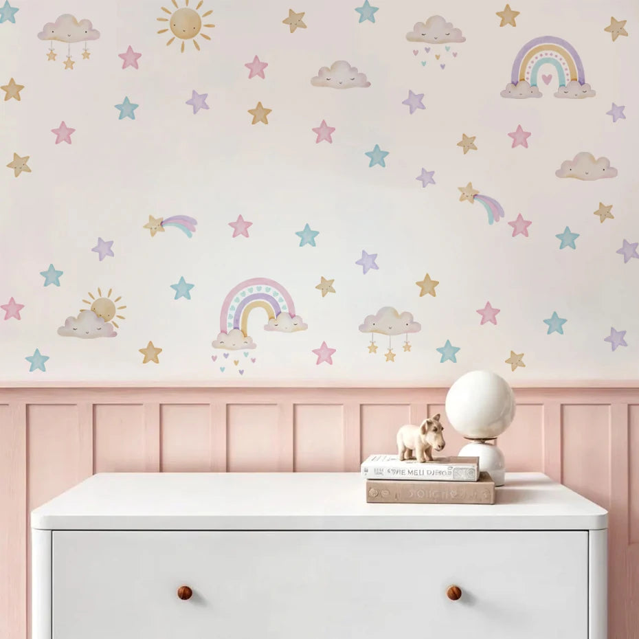 Wall with colorful rainbow, cloud, and star decals on a light pink background.