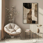 Modern interior with a papasan chair, abstract art, and side tables.