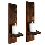 Two wooden wall sconces with candles on a white background