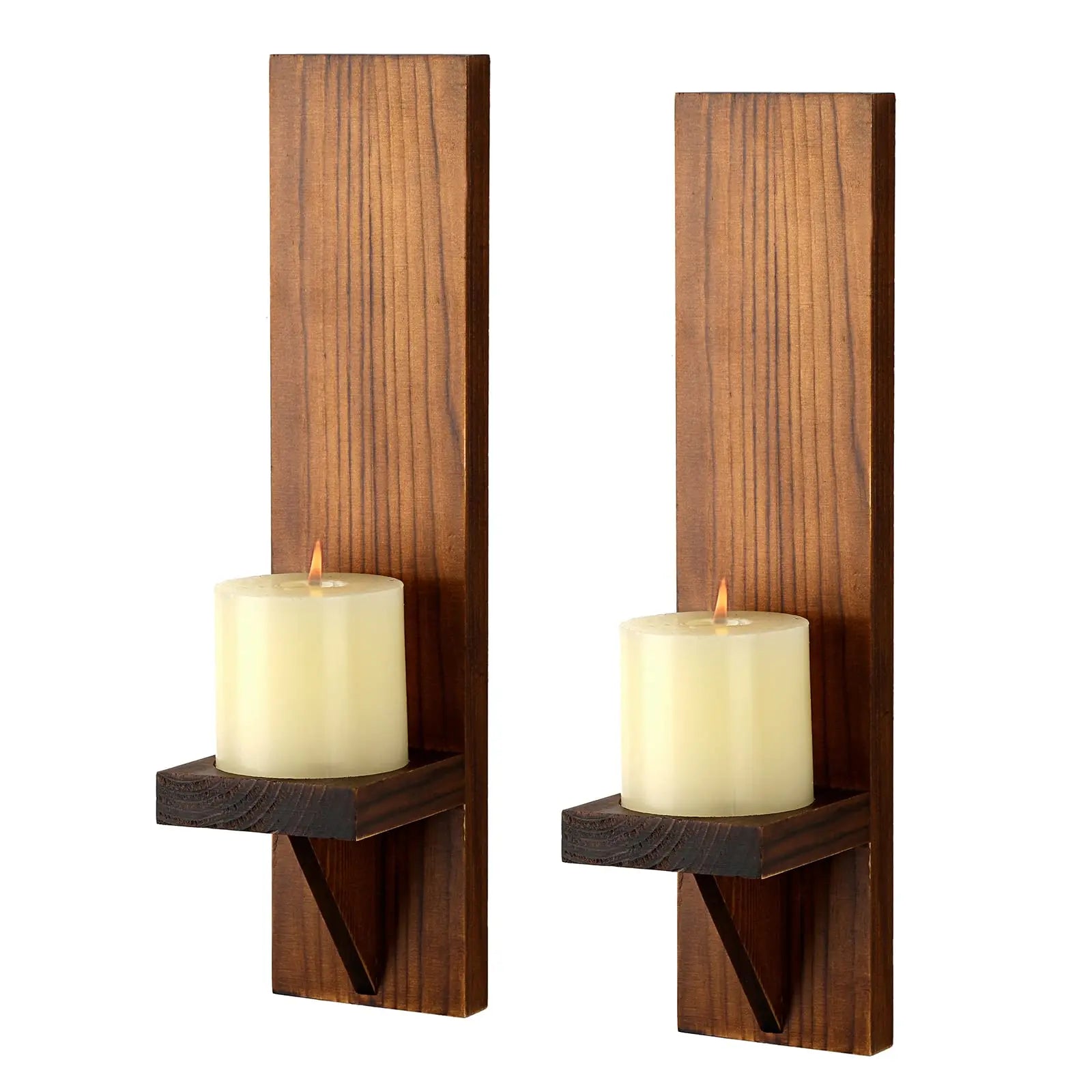 Two wooden wall sconces with candles on a white background