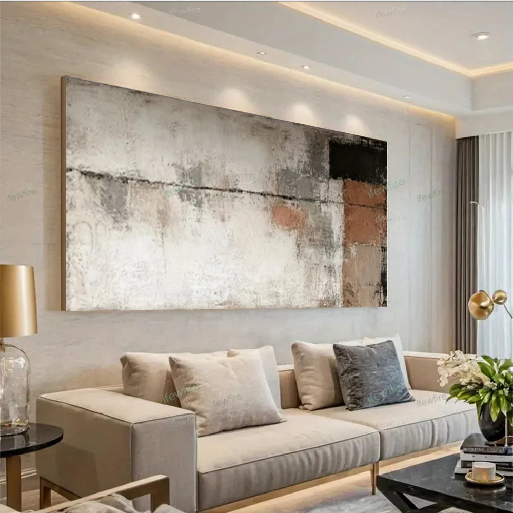 Modern living room with a beige sofa, abstract painting, and decorative elements.