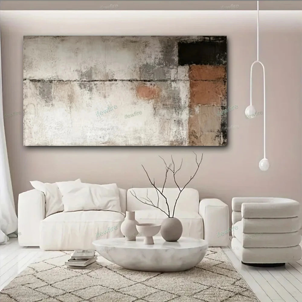 Modern living room with white furniture, abstract painting, and decorative items.