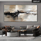 Large framed abstract wall art with sweeping black, beige, white, and gray brushstrokes, displayed above a modern gray sofa in a styled living room. 