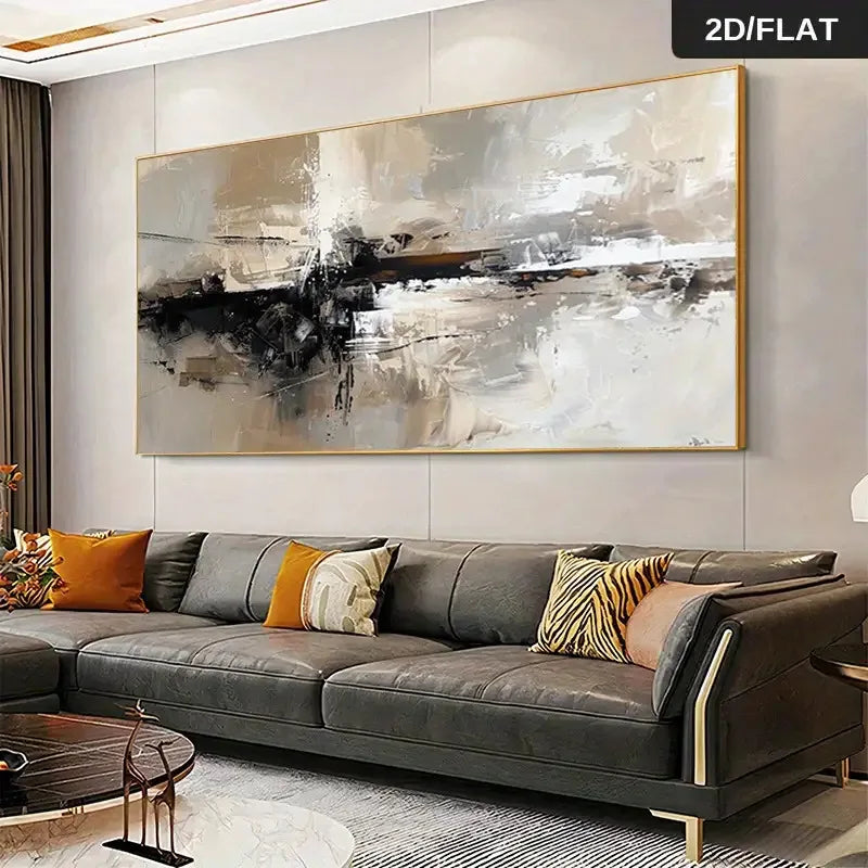 A large framed abstract canvas print with black, gray, white, and beige brushstrokes hangs above a dark gray leather sofa in a modern living room.