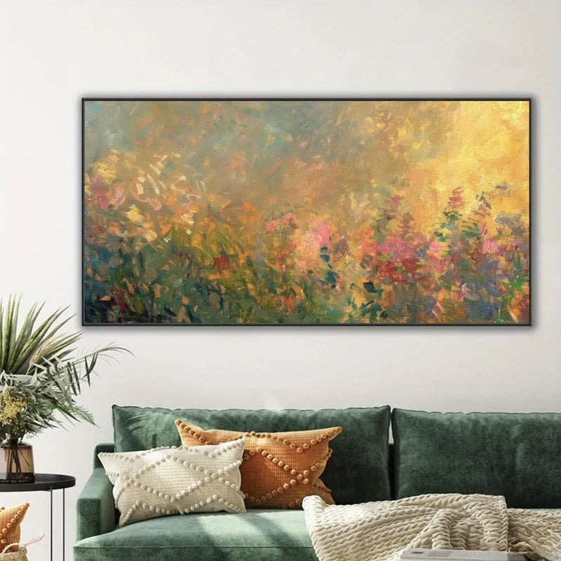 A large abstract floral painting with warm yellow, orange, pink, and green tones hangs on a white wall above a green velvet sofa with decorative pillows.