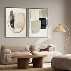 Modern living room with abstract art, beige sofa, and wooden coffee table.