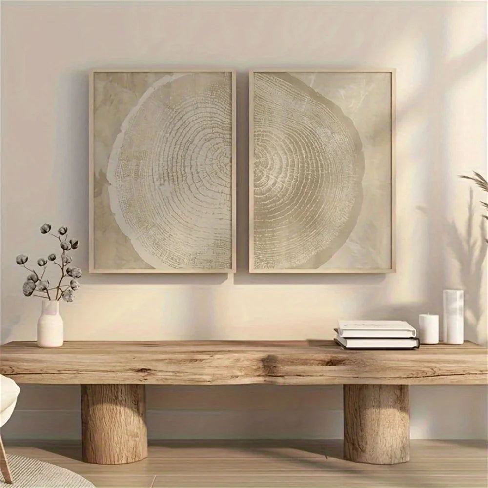 Wooden table with decorative items against a wall with two framed artworks.