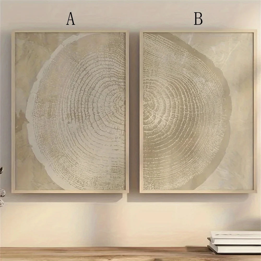 Two framed artworks of tree rings on a wall.