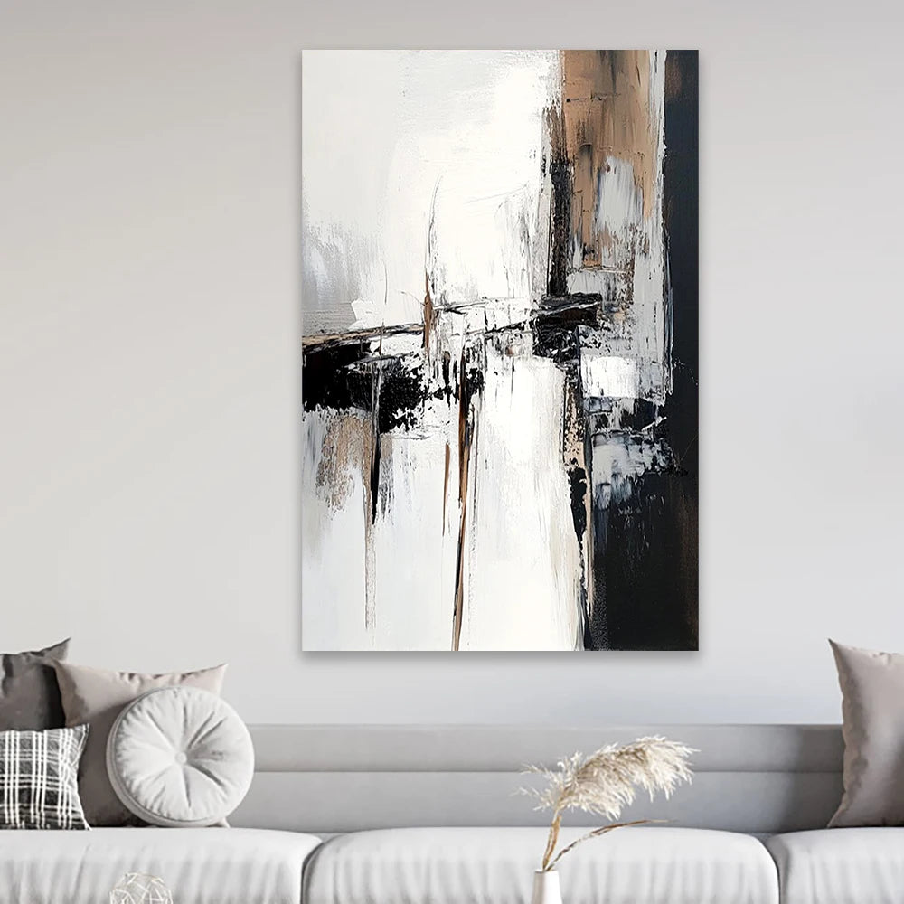 Abstract painting on a wall above a sofa with decorative pillows.