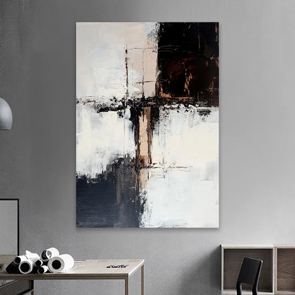 Abstract painting on a gray wall with a table and chair in the foreground