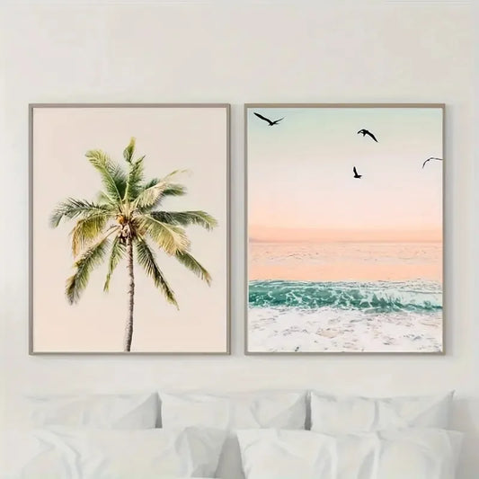 Two framed artworks of a palm tree and beach scene on a wall above a sofa.