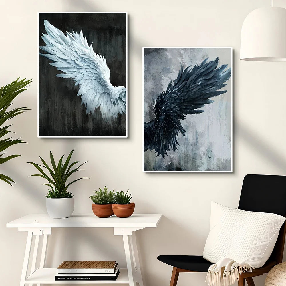 Two angel wing paintings on a wall with a table and chair in the foreground.