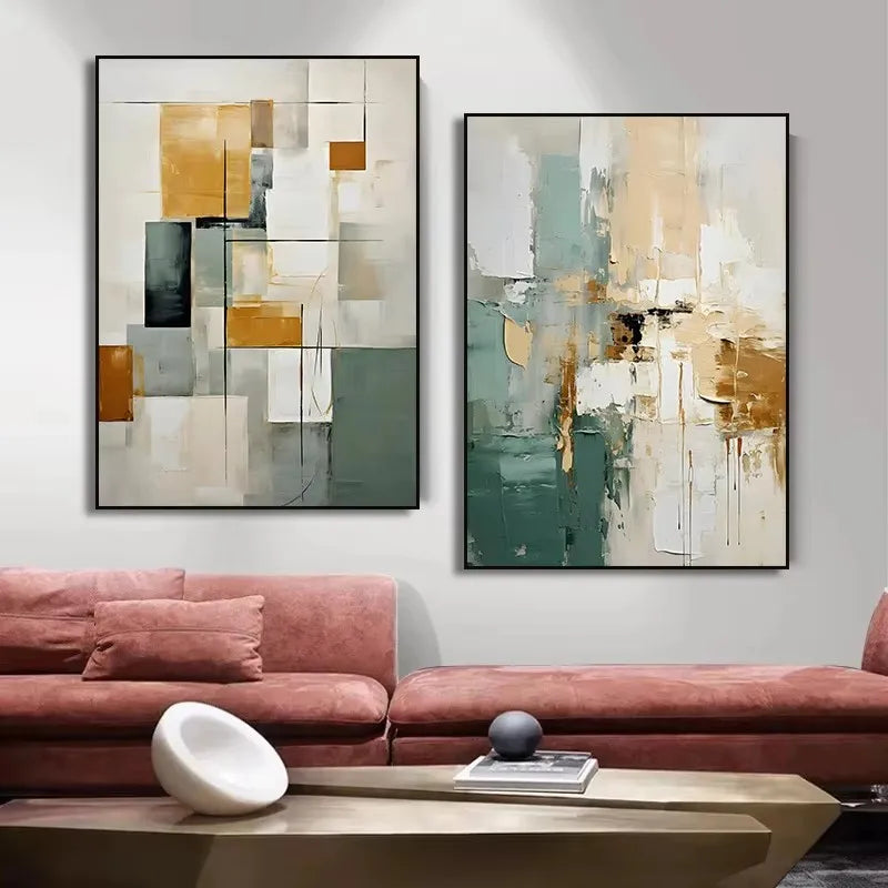 Two abstract paintings on a wall above a pink sofa with a wooden coffee table.