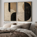 Abstract wall art above a bed in a bedroom setting