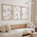 Modern living room with abstract wall art and a sofa.