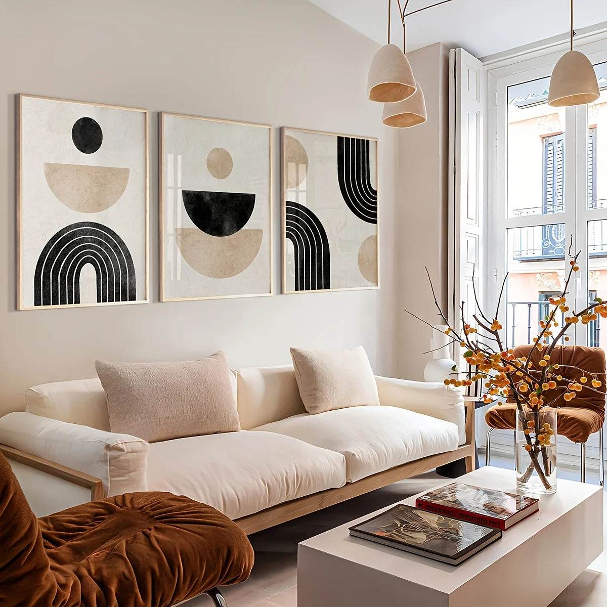 Modern living room with a white sofa, abstract art, and decorative elements.