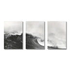 Triptych of black and white ocean wave prints on a white background