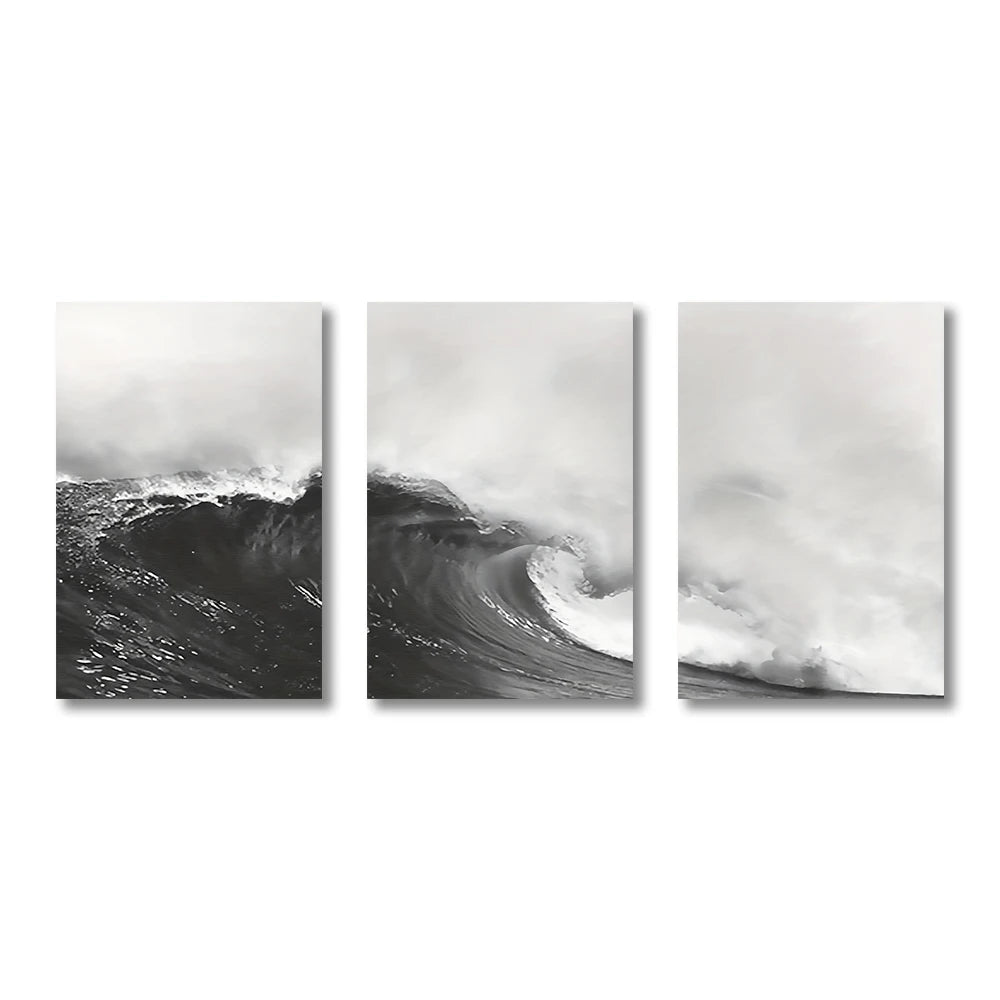 Triptych of black and white ocean wave prints on a white background