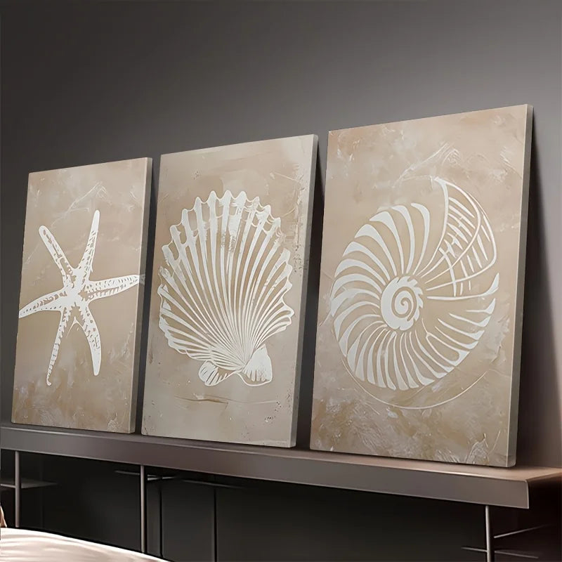 Three wall art panels with starfish, shell, and spiral designs on a dark background.