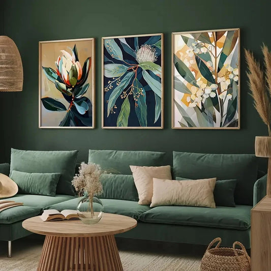 Living room with green walls, a teal sofa, and floral wall art.