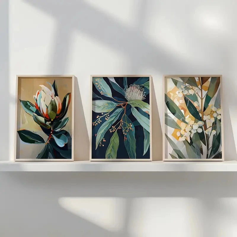 Three framed botanical artworks on a white wall