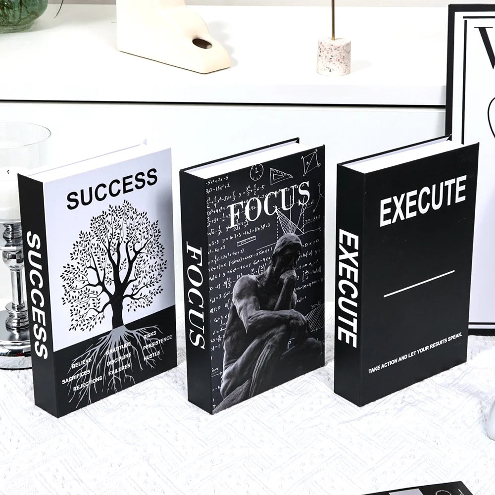 Three books titled 'Success', 'Focus', and 'Execute' on a white surface.