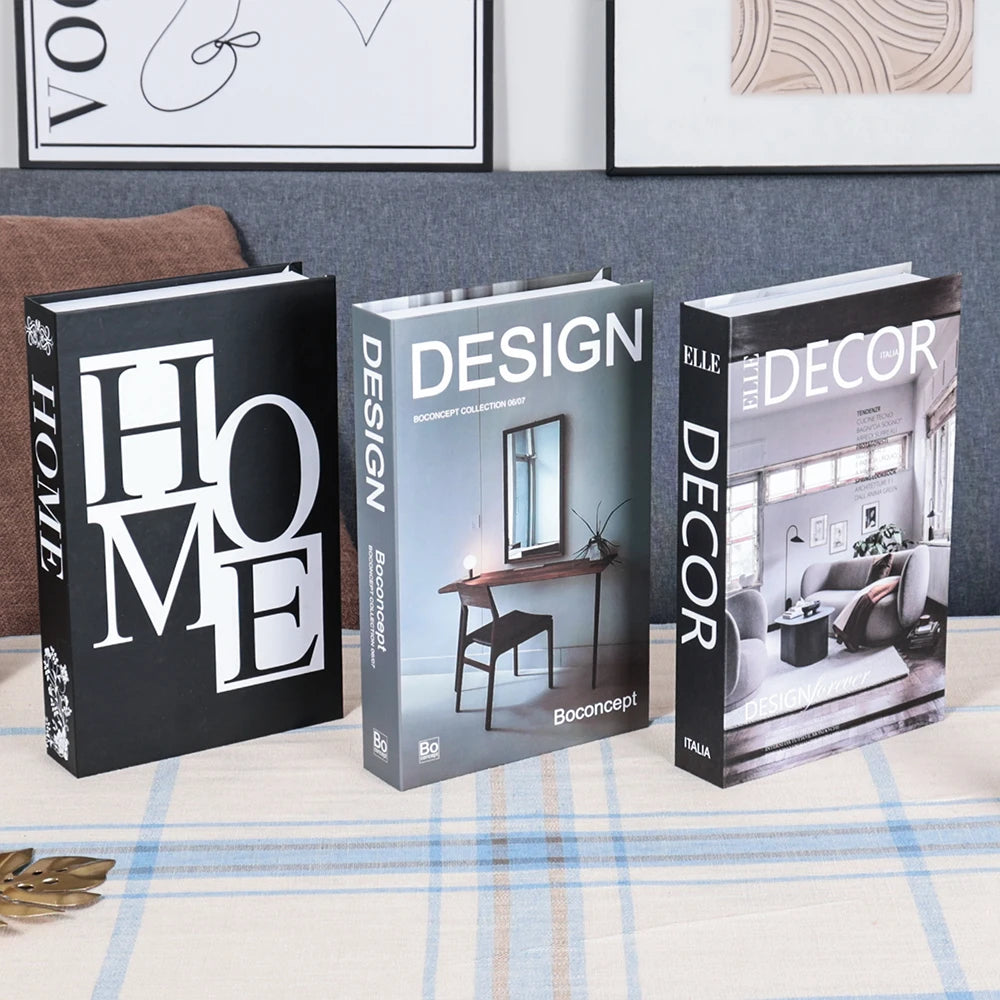 Three design books titled 'HOME', 'DESIGN', and 'DECOR' on a table with a home decor background.