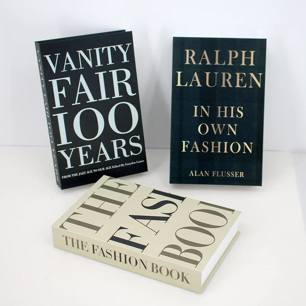 Three books titled 'Vanity Fair 100 Years', 'Ralph Lauren in His Own Fashion', and 'The Fast Book' on a white background.