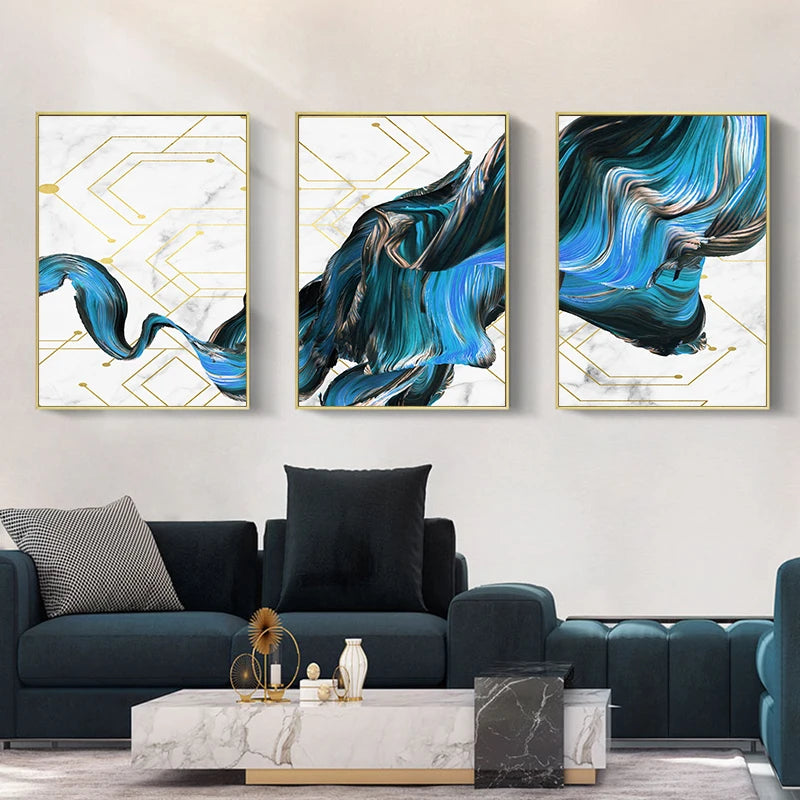 Three abstract art pieces on a wall above a sofa in a living room.