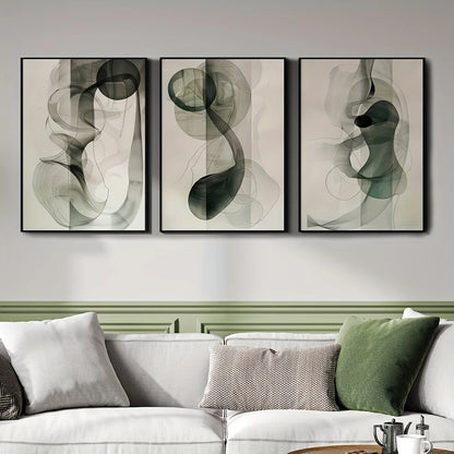 Three abstract art pieces hanging above a sofa in a living room.