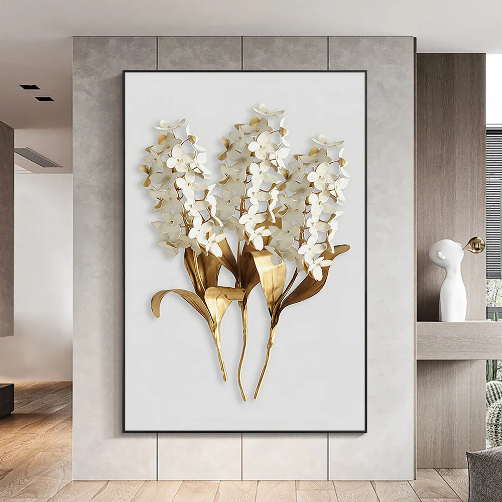 Decorative wall art of white flowers with gold accents on a light gray background