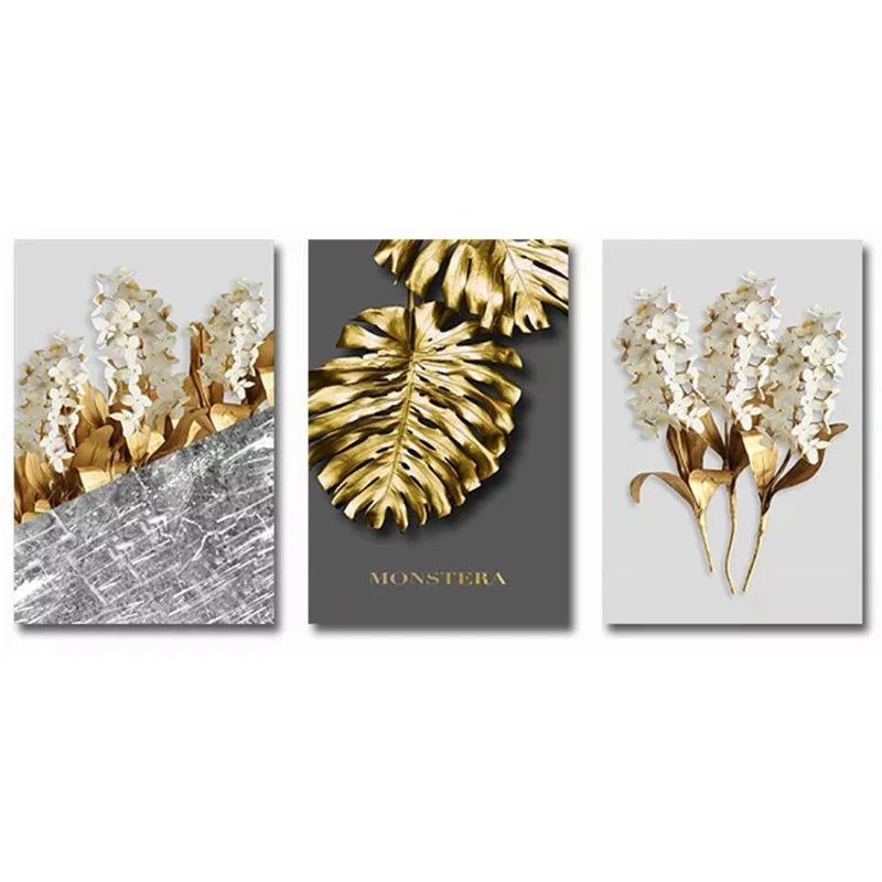 Set of three wall art prints featuring gold and white floral designs on gray backgrounds.