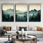 Three framed landscape paintings of mountains and trees above a sofa in a living room.