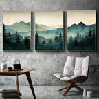 Three landscape paintings of mountains and trees on a wall above a chair and table.