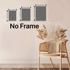 Wall decal without a frame displayed with a chair and vase of flowers.