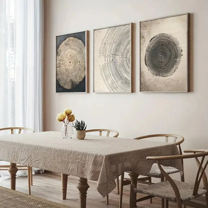 Dining room with a table and chairs, featuring three circular wall art pieces on the wall.