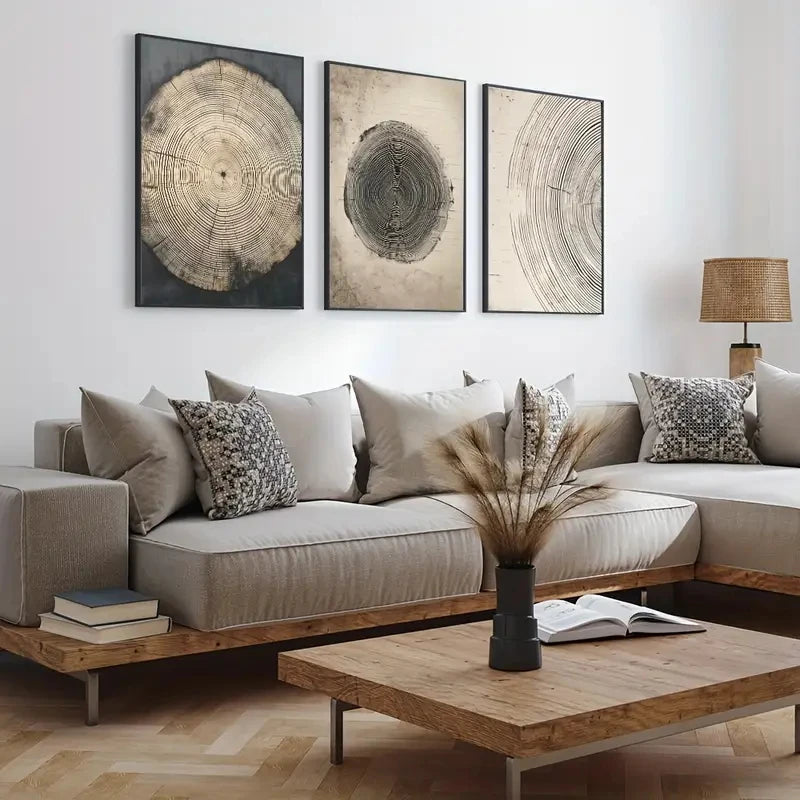Living room with a sectional sofa, coffee table, and wall art depicting tree rings.