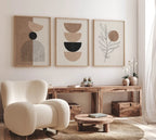 Modern living room with abstract wall art, a beige armchair, and wooden furniture.