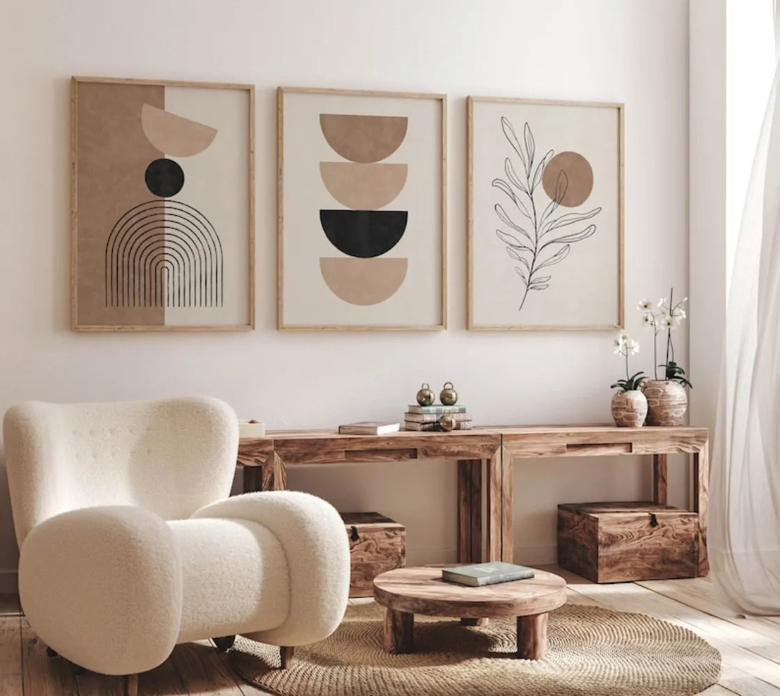Modern living room with abstract wall art, a beige armchair, and wooden furniture.