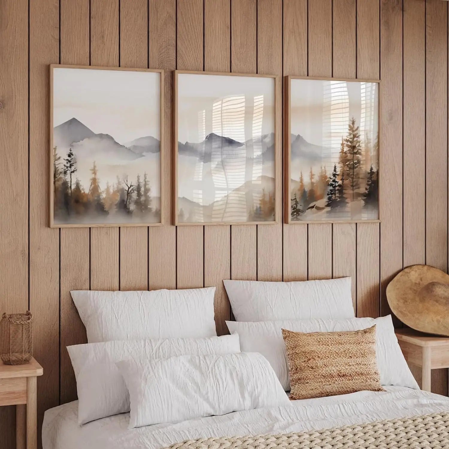 Bedroom with wooden headboard, mountain-themed wall art, and textured pillows.