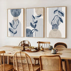 Dining room with a wooden table and chairs, featuring abstract wall art on the wall.