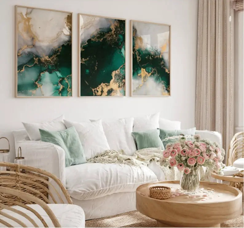 Living room with a white sofa, wicker chairs, and abstract art on the wall.