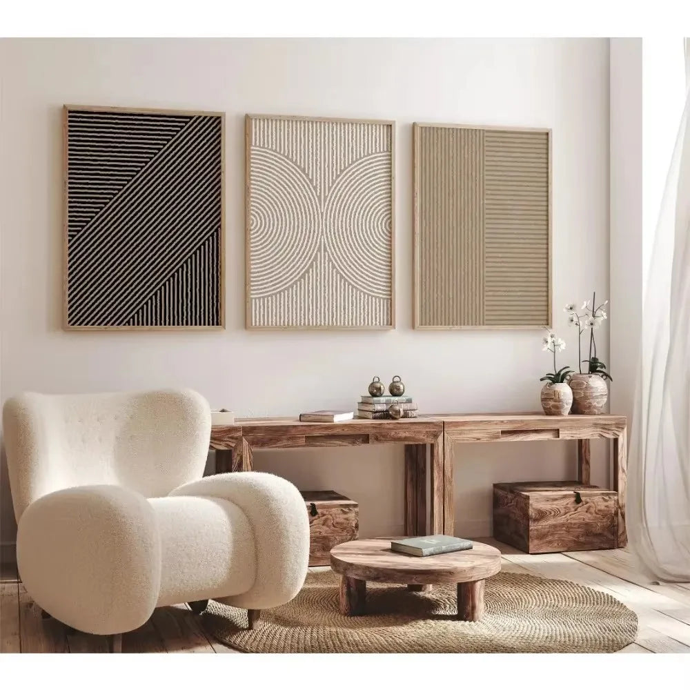 Modern living room with a white armchair, wooden coffee table, and decorative wall art.