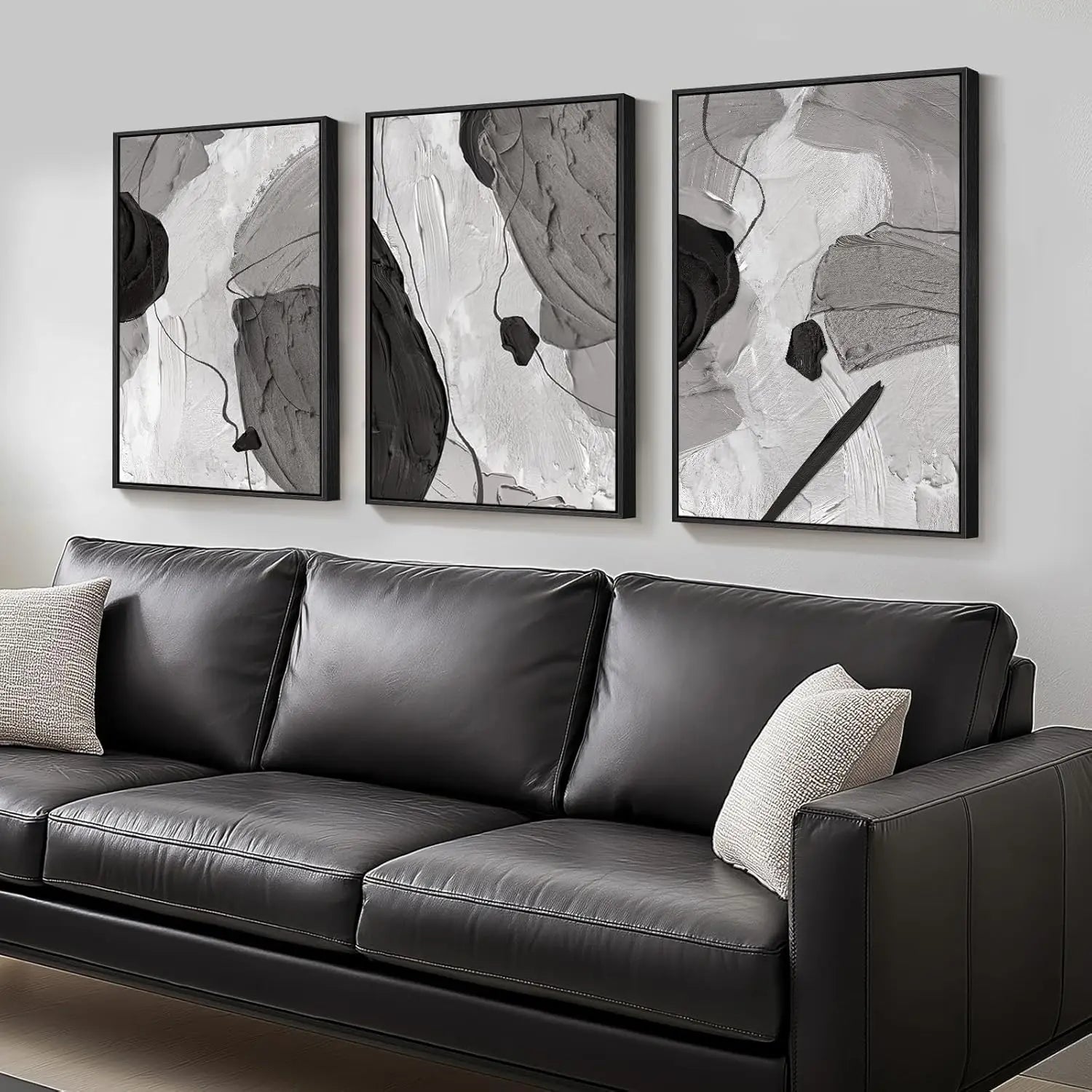 Gray leather sofa with abstract art on a wall
