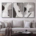 Gray sofa with abstract art on the wall