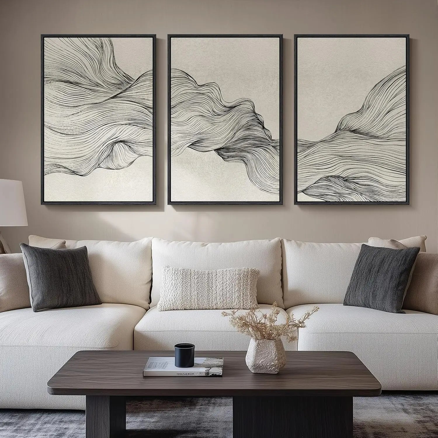 Living room with a white sofa, wooden coffee table, and abstract wall art.